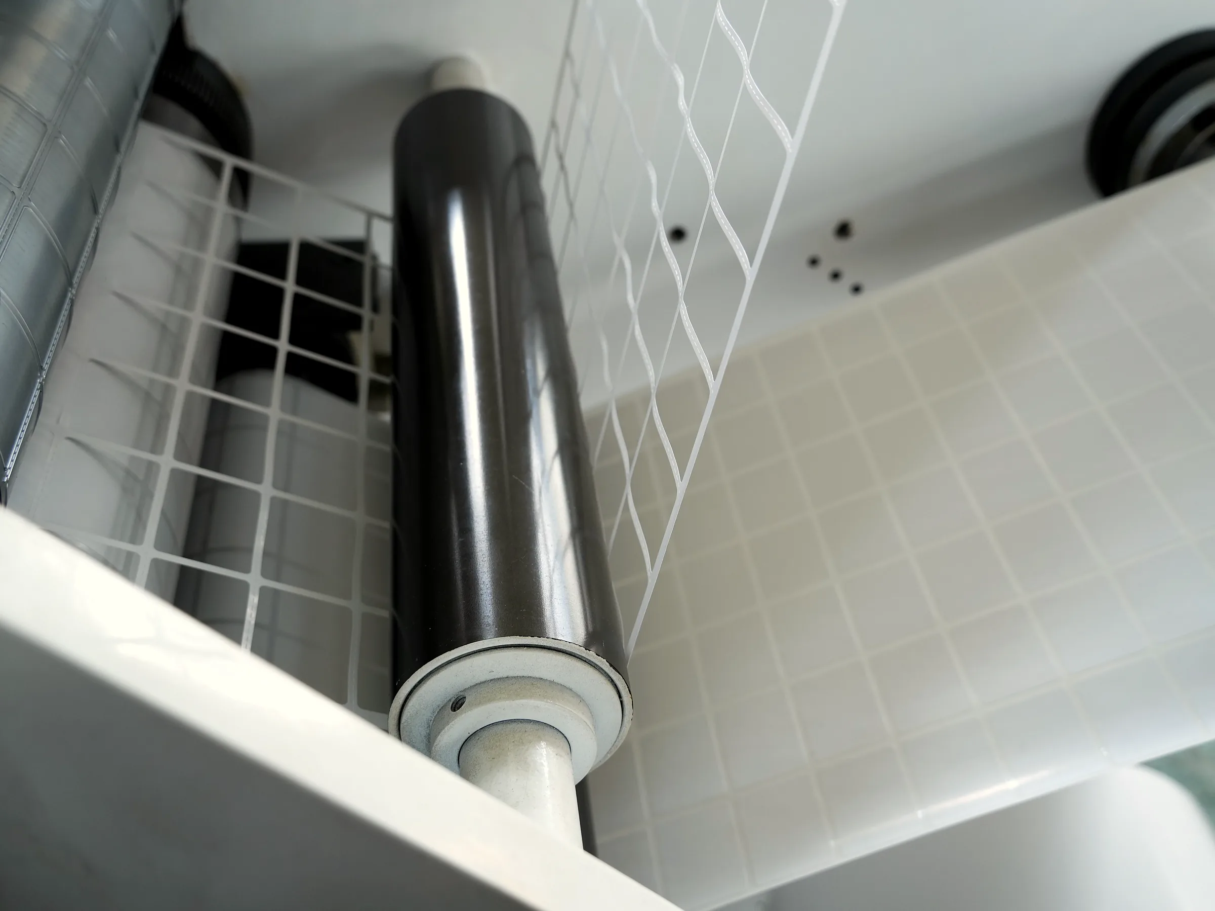 Die-cutting process with rollers converting packaging material