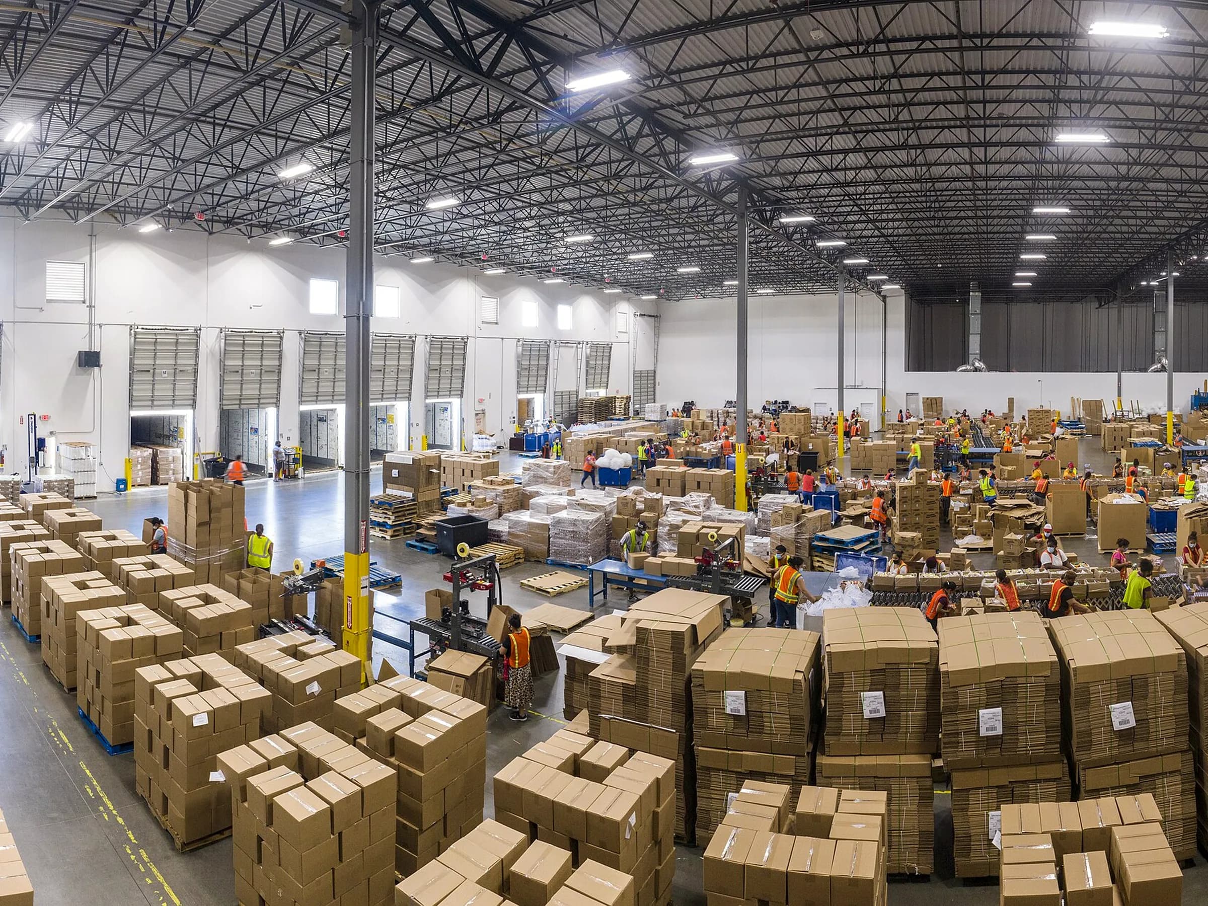 Food packing floor with palletized corrugated shipper cartons ready for dispatch