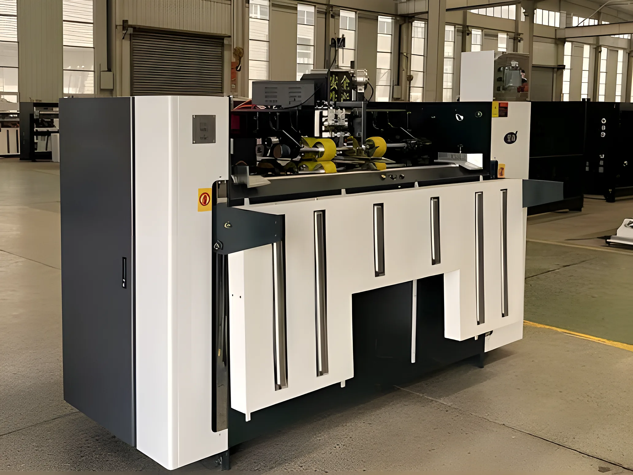 Semi-automatic carton stitching machine on a factory floor
