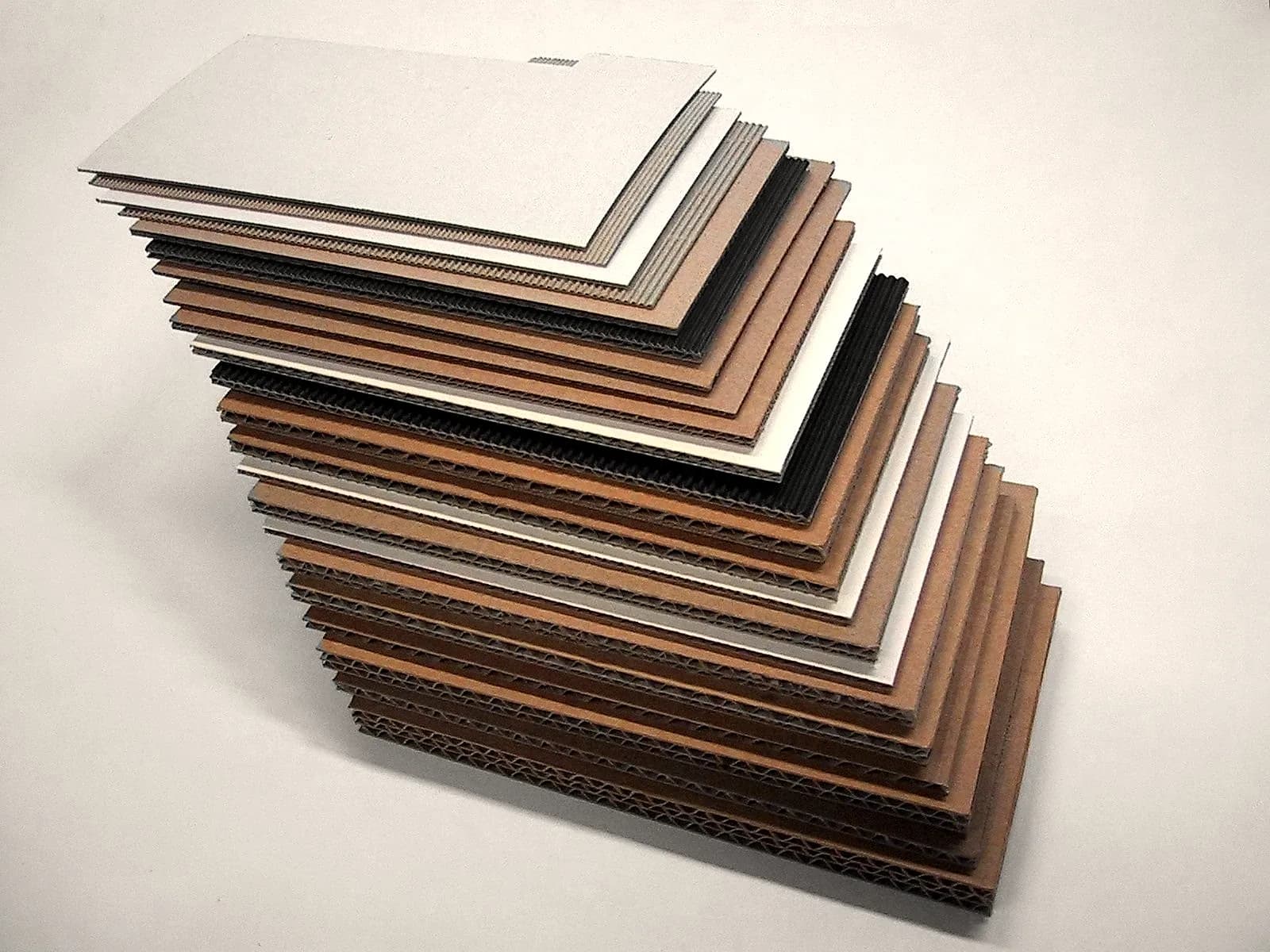 Cut section of corrugated board showing flute profiles