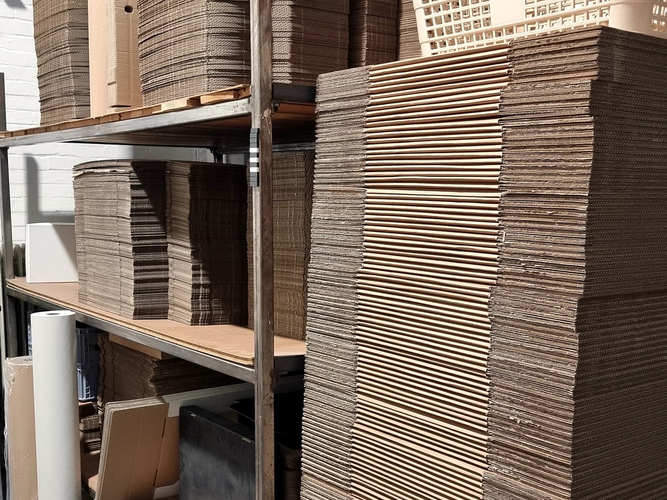 Stacks of finished cartons stored in a packaging warehouse